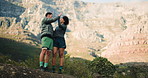 Hiking, high five and couple with fitness, support and goals with challenge, environment and nature. Outdoor, endurance and man with happy woman, achievement and trekking together with relationship