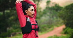 Woman, fitness and stretching arm in forest for wellness, outdoor exercise or hobby for healthy body. Workout, trail running and African person in woods, marathon training and dedication for benefits