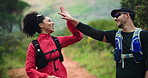 Running, team and high five with couple in nature for exercise, trekking adventure and support. Workout, motivation and training with man and woman on forest trail for runner partner and fitness