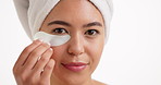 Face, skincare and woman with eye patch, studio and facial treatment for hydration and mockup space. White background, Asian person and cosmetics with anti aging benefits, dermatology and self care