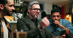 Winner, phone and fist pump with people at pub for streaming game, sports score and goal. Team support, fans celebration and competition with friends in bar for live broadcast and match results