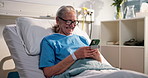 Healthcare, laughing and phone with old woman in hospital bed for recovery from operation or surgery. App, funny and social media with happy senior patient in clinic for communication or treatment