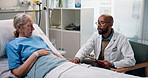 Doctor, consultation and bed with senior patient for medical diagnosis or procedure in hospital. Man, woman and healthcare consultant talking to elderly client for exam or test results in clinic