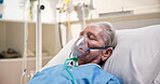 Sick, senior woman and oxygen mask in hospital bed for respiratory disease, ventilation or asthma. Healthcare, elderly patient or sleep with respirator in intensive care for breathing support or rest