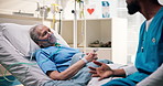 Doctor, senior and consulting with patient in hospital bed for recovery, diagnosis or feedback. Woman, man and nurse talking to elderly for medical attention, emergency or ICU ward in health clinic