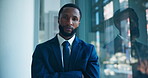 African businessman, face and arms crossed at office with pride by window for career at insurance agency. Person, portrait and confidence with risk management job at corporate company in Nigeria