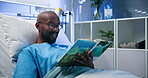 Black man, patient and reading book in bed at hospital for learning, fantasy story and recovery. Smile, male person and rest with fiction novel of education, healing therapy and cognitive stimulation