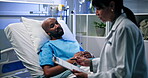 Doctor, clipboard and consulting man in hospital bed for health insurance, treatment plan or night. Healthcare, patient and expert with report in clinic for medical feedback, prescription and support