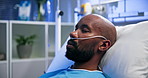 Hospital, healthcare and black man with oxygen tubes on bed for emergency, rest and recovery sleep. Nasal cannula, breathing and patient with medical ventilation, respiratory support or sick in ICU