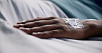 Hands, person and patient with iv drip on hospital bed for medical condition, sedation and hydration. Sick, man and infusion therapy for medicine, nutrition support and icu recovery for post surgery