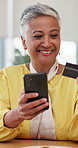 Mature, woman with phone and credit card for online shopping and happy dance for checkout discount. Mobile app, person and payment success with fintech, ecommerce and excited for transaction at home