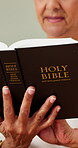 Hands, woman and reading bible in house for religious study, spiritual growth or knowledge of God. Christianity, person and Holy book in home for scripture guidance, praise Jesus and learning faith