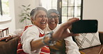 Selfie, laugh and senior friends in home with bonding, memory and connection together in living room. Relax, phone and elderly women in retirement on sofa with photography picture in apartment.