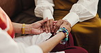 Women, holding hands and empathy in home for trust, compassion and friends with grief and helping. House, care and comfort for person in living room, consoling or understanding of trauma or kindness