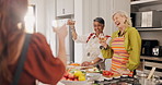 Funny, toast and senior friends in kitchen of home together for bonding, cooking or visit. Cheers, drink and laughing with happy old women in apartment for healthy celebration or culinary class