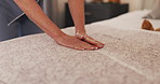 Cleaning, hands and blanket with woman and bed for housekeeping, dusting and hospitality. Mattress, fabric and duvet bedding with closeup of cleaner in bedroom of hotel for hygiene, tidy and chores