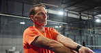 Athlete, man and stretching for padel sport with game challenge, fitness competition or ready for tournament. Mature person, exercise and warm up for agility, cardio match and wellness in gym club