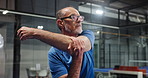 Senior man, fitness and stretching with arm for workout preparation, exercise or physical training. Elderly, male person or getting ready with warm up in health club or gym for flexibility or start