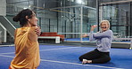 Padel court, happy women and stretching with trainer for sports, training preparation or funny joke. Tennis, mature people and warm up arms with coach for fitness exercise, health or laugh together