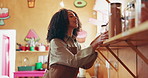 Chef, kitchen and woman with spice shelf, cooking and ingredients with decision. Happy, person and employee with gourmet cuisine, recipe and herbs with options, healthy meal and food with choice