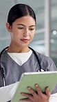 Internet, doctor and woman in hospital, tablet and typing with healthcare, email and research. Person, medical service and professional in clinic, telehealth or review results with app and planning