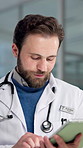 Internet, doctor and man in hospital, tablet and typing with healthcare, app and research. Person, medical service and professional in clinic, telehealth or review results with connection and email