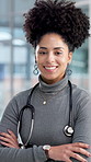 Doctor, happy and face of woman in hospital with crossed arms for medical service, career and job. Healthcare, professional and portrait of person with confidence for wellness, clinic and about us