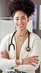 Face, doctor and woman in hospital, arms crossed and wellness with peadtrician, smile and pride. Career ambition, medical service and professional in clinic, stethoscope and about us with healthcare