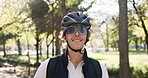 Sunglasses, cyclist and happy man in park with helmet, safety gear or ready for morning commute. Smile, travel and person outdoor in nature with bicycle equipment, eyewear and protection for cycling.