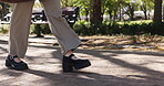 Walking, legs and business woman in park for morning commute, career journey and trip. Professional, steps and travel with shoes of employee on path outdoor for urban, pedestrian and corporate