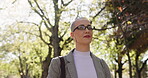 Glasses, morning walk or woman in park, thinking or environmental lawyer for eco transformation. Outdoor, sustainable change or employee traveling in nature, conservation and preservation for ecology