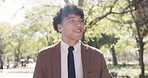 Walking, smile and business with man in park for morning commute, career journey and trip. Professional, confidence and travel with male employee outdoor for urban, pedestrian and corporate person