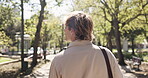 Walking, back and business with man in park for morning commute, career journey and trip. Professional, confidence and travel with male employee outdoor for urban, pedestrian and corporate person