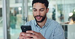 Business, man and typing with phone in office for text message, email response or check schedule. Bokeh, happy employee and smartphone at desk for online networking, work break and internet research