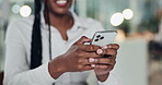 Hands, business woman or browsing with phone in office for social media post, work break or research. Bokeh, happy employee and smartphone at desk for online networking, app download or web scrolling