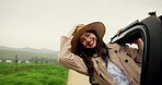 Happy woman, face and window with car in countryside for travel, adventure or outdoor journey. Portrait, female person or passenger with hat in vehicle for freedom, holiday or vacation in nature