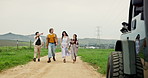 Couple of friends, travel and walking in countryside for road trip, sightseeing and bonding journey. Happy, people and outdoor on route with pointing, direction and talking on vacation at vehicle 