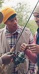 Fishing, talking and help with friends outdoor for adventure, casting advice and bonding. Fisherman season, reel gear discussion and camping vacation with group of people in nature for rod equipment