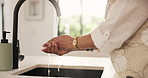 Woman, hands and washing with water in kitchen for hygiene, disinfection or cleaning in home. Mature, female person or rinse with tap, sink or soap for cleanliness, bacteria or germ removal in house