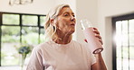 Home, milkshake and senior woman with nutrition, wellness and breakfast detox with fitness. Apartment, pensioner and mature person with healthy drink, protein and smoothie with vitamins and cleanse