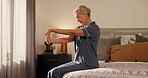 Mature, woman and stretching in bedroom with wrist pain, carpal tunnel and body care for joint injury. Senior, female person and massage in home for arthritis, inflammation and osteoporosis relief.