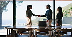 Handshake, greeting or business people in office for collaboration, feedback or contract on laptop. Tech, team and shaking hands in workplace with meeting for investment, partnership and agreement.