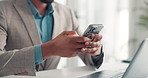 Hands, phone and texting in office with contact for proposal, deal or laptop at investment company. Person, broker and smartphone for fintech, mobile app and scroll for notification at finance agency