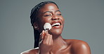 Happiness, brush and black woman in studio, makeup and foundation on gray background. Space, cosmetic tools and African person with beauty, laughing and dermatology with glow, smile and aesthetic