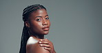 Dermatology, beauty and face of black woman on gray background for wellness, health and glow in studio. Skincare, African model and portrait of girl for cosmetics, aesthetic and mockup space pride