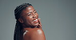 Laugh, shoulder and skincare with face of black woman in studio for body care, beauty and shine. Dermatology, mockup space and hydration glow with person on background for clear skin and collagen
