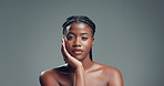 African girl, touch face and studio for beauty with texture, pride and results on background. Black woman, mockup space and portrait with dermatology, skincare and natural cosmetics in Nigeria
