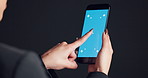 Blue screen, cellphone and woman in studio with networking, communication or social media on mobile app. Technology, mockup space and female person with phone for contact by black background.
