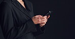 Texting, employee and hands with smartphone, studio and communication for funding opportunity on web. Typing , message and person with mobile for investment, black background and mockup space or chat