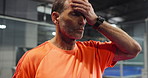 Padel, tennis and man on court rest for training, match and practice game in sports club. Fitness, exercise and mature person with sweat, breathe and break for challenge, tournament and competition